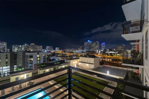 a kitchen with stainless steel appliances kitchen island granite countertop a sink and cabinets