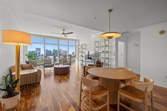 a view of a dining room with furniture window and outside view