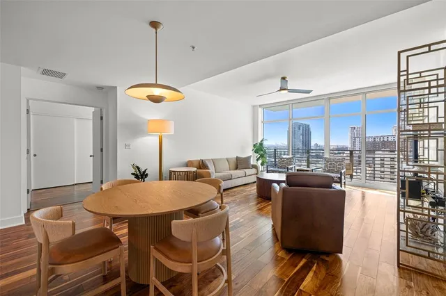 a view of a dining room with furniture window and outside view