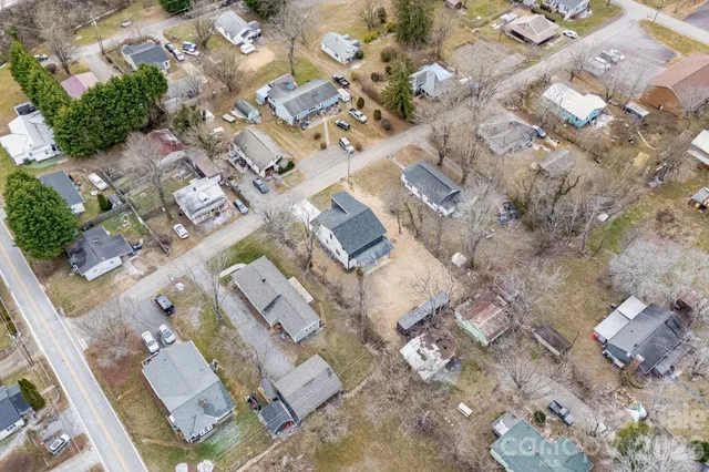 a aerial view of a house with a yard