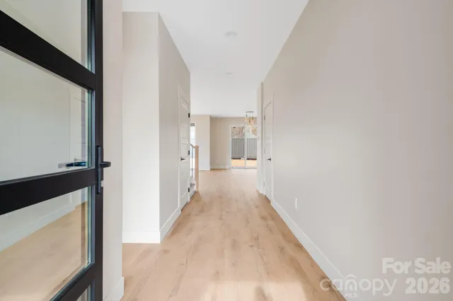 a view of a hallway with a white walls