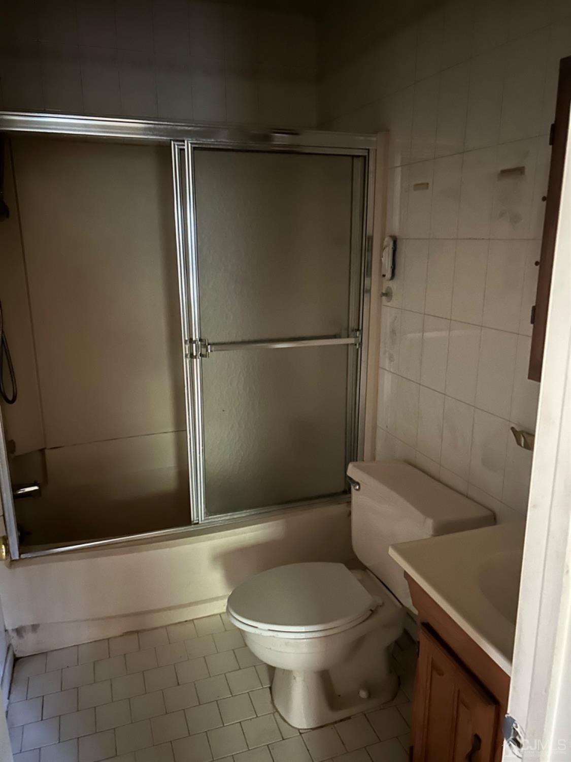 6 Woodbury Road Edison, NJ 08820 - Photo 5 of 18 a bathroom with a shower and a toilet