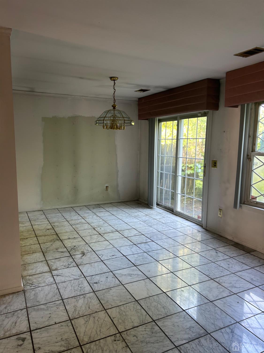 6 Woodbury Road Edison, NJ 08820 - Photo 10 of 18 a view of an empty room and window
