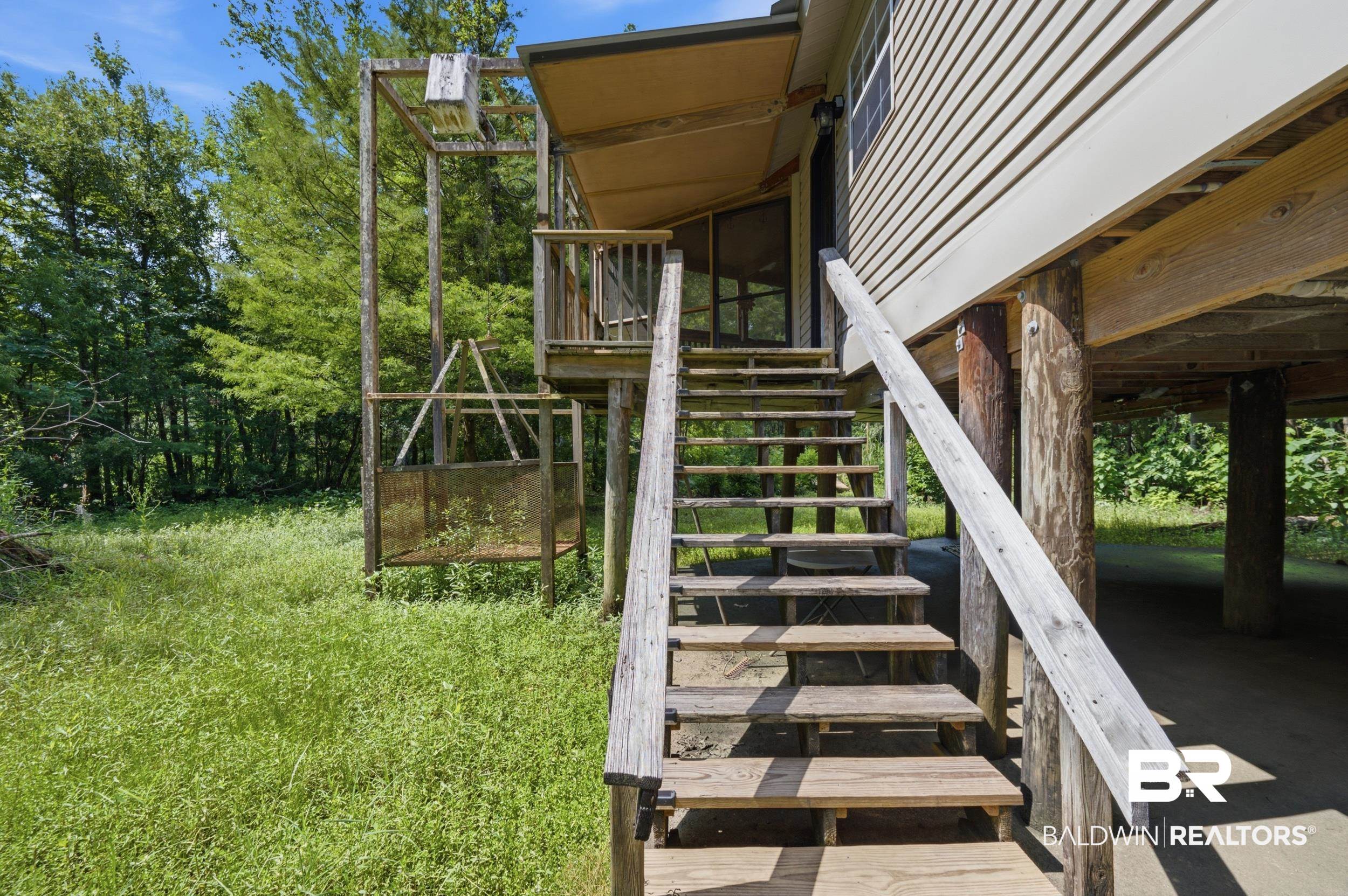 42080 Bayou Road Bay Minette, AL 36507 - Photo 7 of 43 Elevated residence featuring wood siding and a covered porch