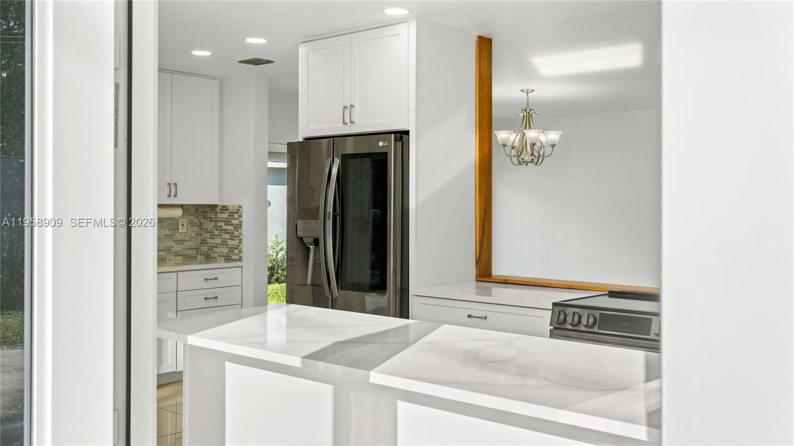 8614 Southwest 102nd Place Miami, FL 33173 - Photo 13 of 47 a bathroom with a sink and a mirror