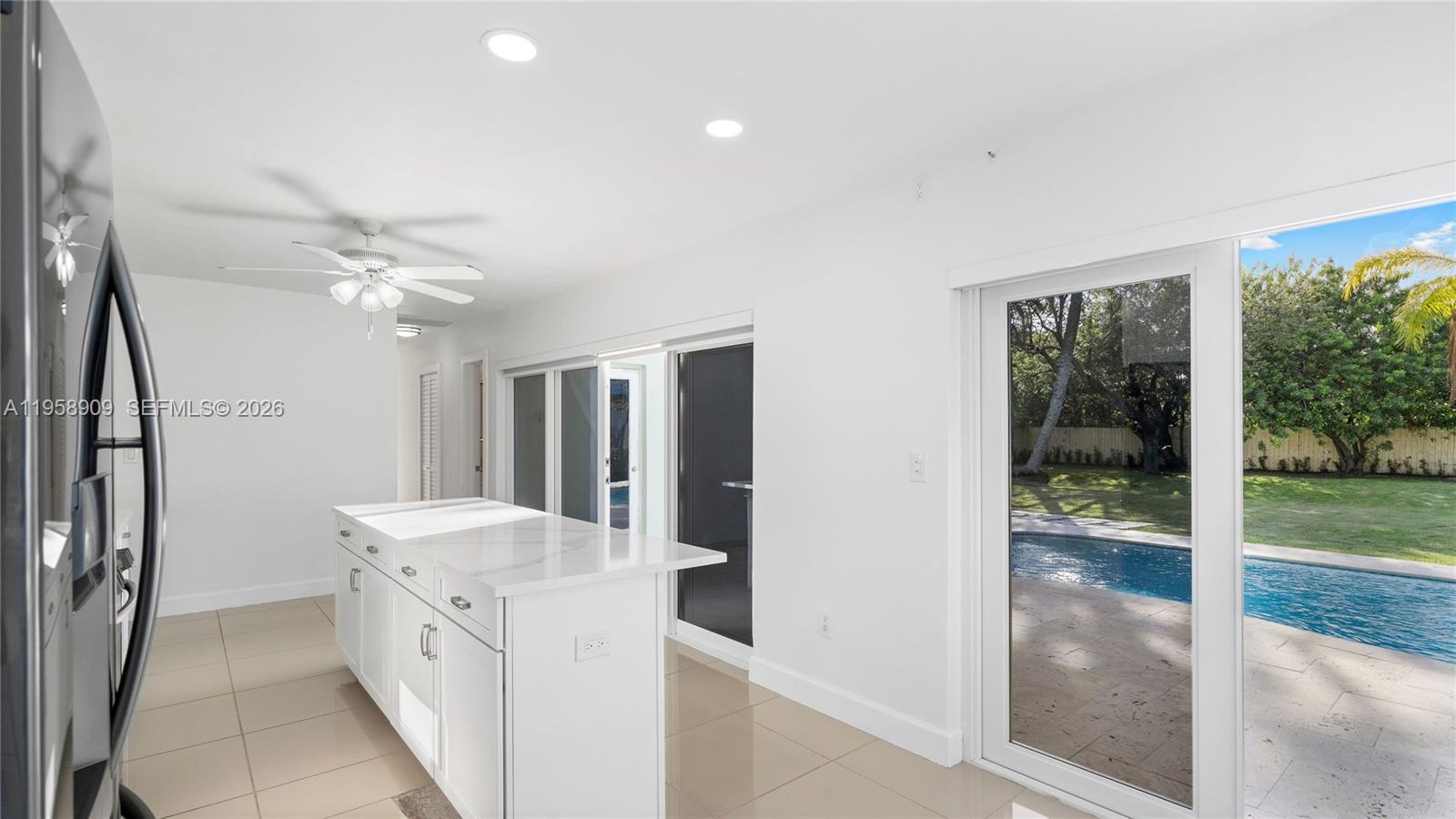 8614 Southwest 102nd Place Miami, FL 33173 - Photo 14 of 44 a bathroom with a sink a mirror and a shower