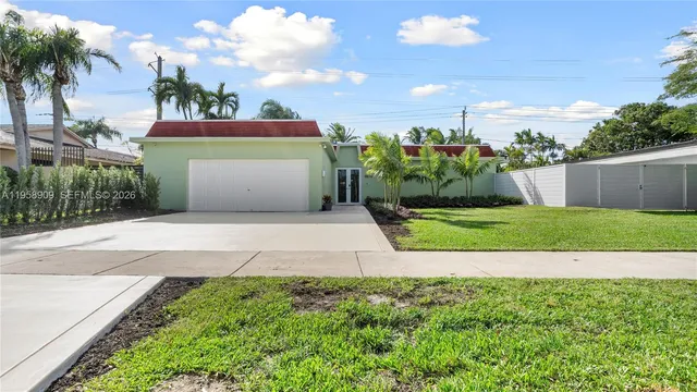 a view of a yard with palm trees
