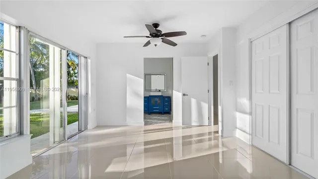 a view of a bathroom with a shower and a sink