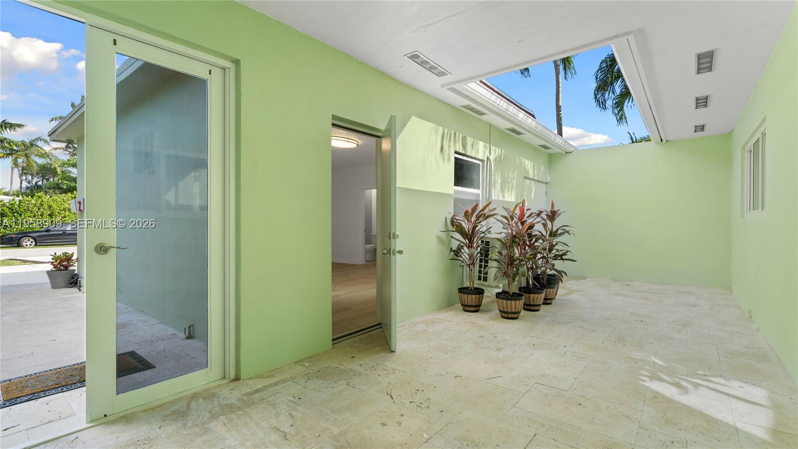 8614 Southwest 102nd Place Miami, FL 33173 - Photo 4 of 47 a view of entryway and hall with a elevator