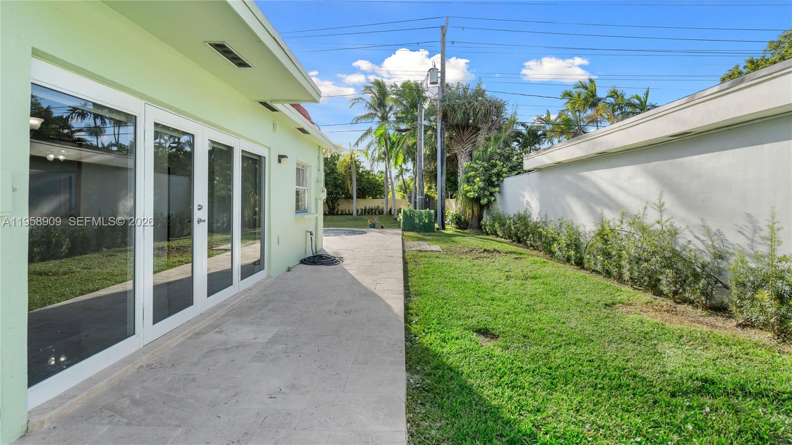 8614 Southwest 102nd Place Miami, FL 33173 - Photo 42 of 47 a view of a house with a yard and potted plants