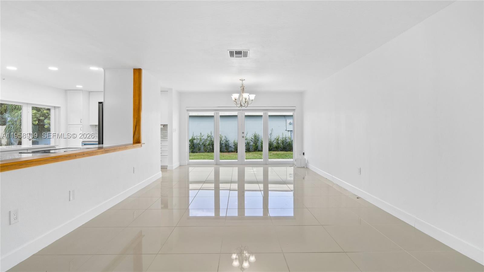 8614 Southwest 102nd Place Miami, FL 33173 - Photo 7 of 44 a view of an empty room and window