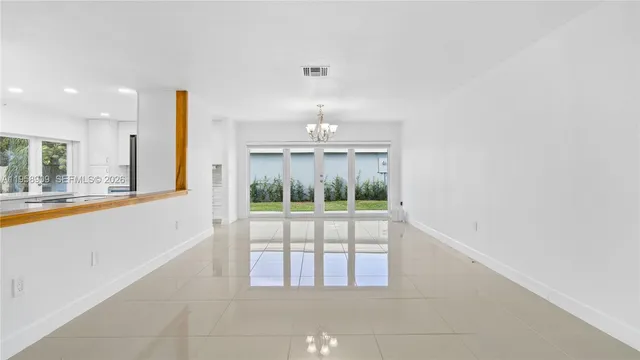 a view of an empty room and window