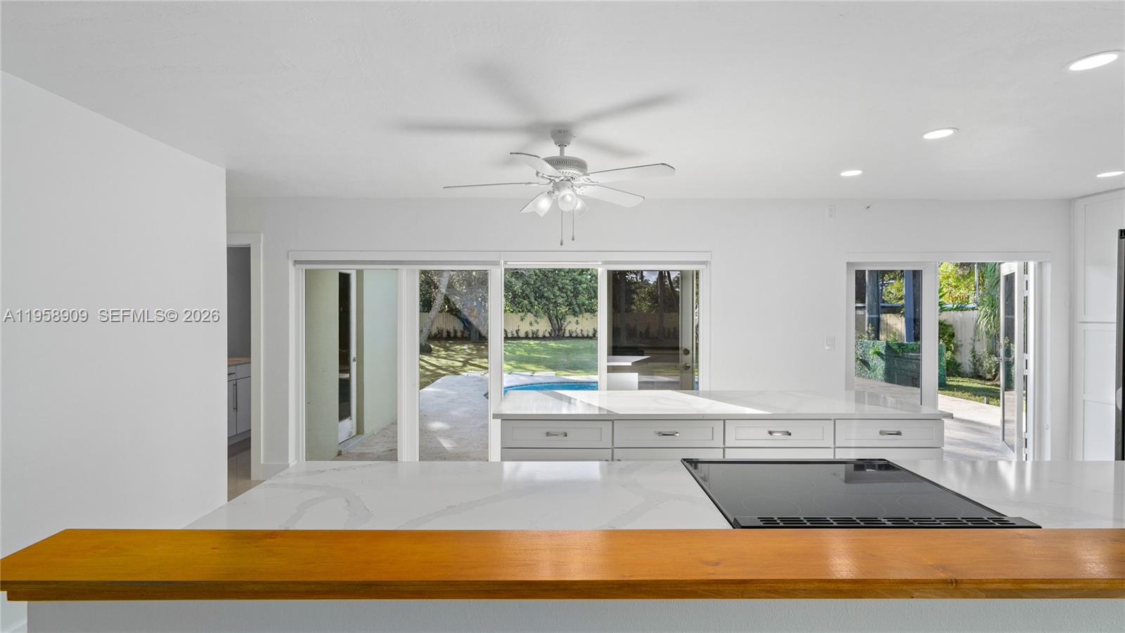 8614 Southwest 102nd Place Miami, FL 33173 - Photo 9 of 44 a view of swimming pool with seating space