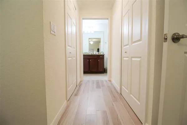 a bathroom with a granite countertop toilet sink and mirror