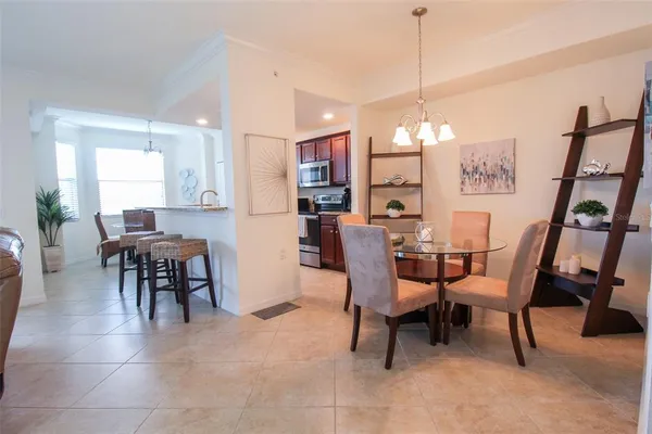 a dining room with furniture and window