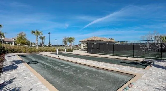 a view of a street with a building in the background