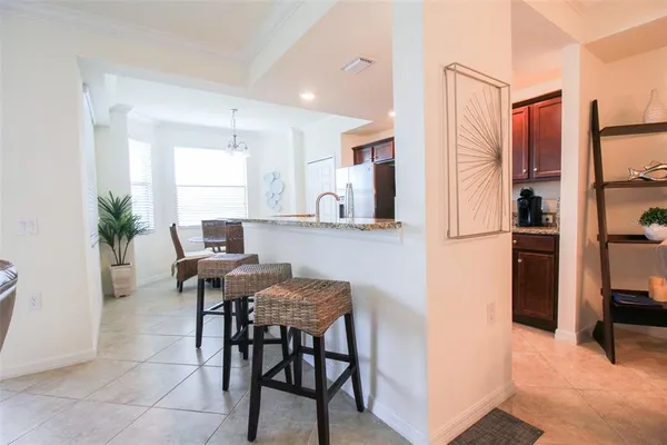 a kitchen with stainless steel appliances granite countertop a stove refrigerator and a sink