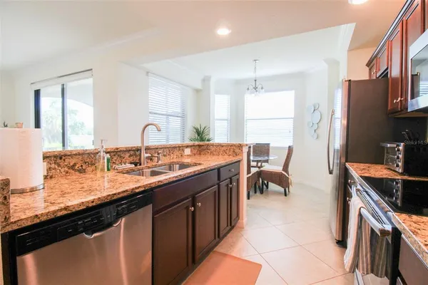 a kitchen with a sink a counter top space and cabinets