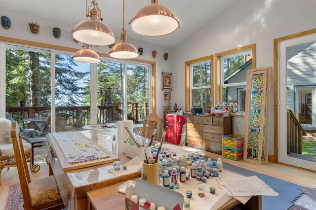 a view of a dining room with furniture window and outside view