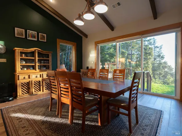 a kitchen with stainless steel appliances granite countertop a sink a stove and a wooden cabinets