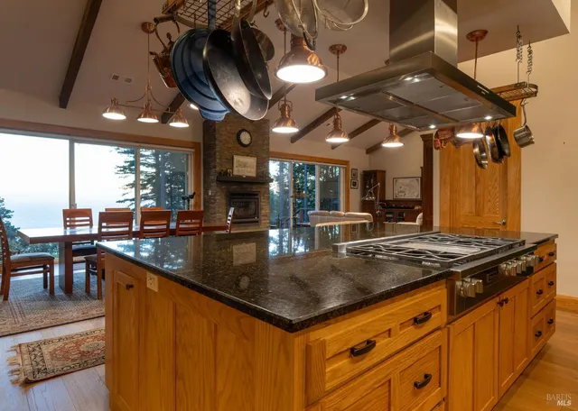 a view of a house with a big yard and large trees