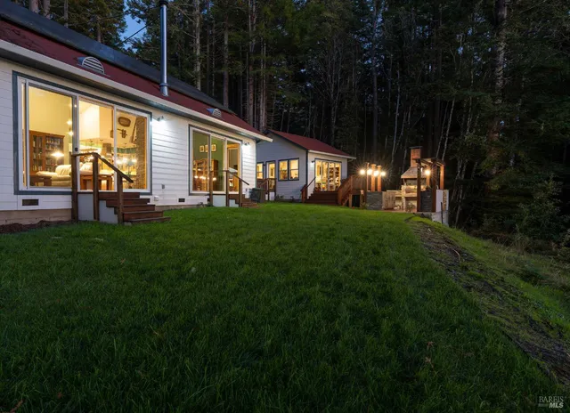 a kitchen with a table and chairs in it