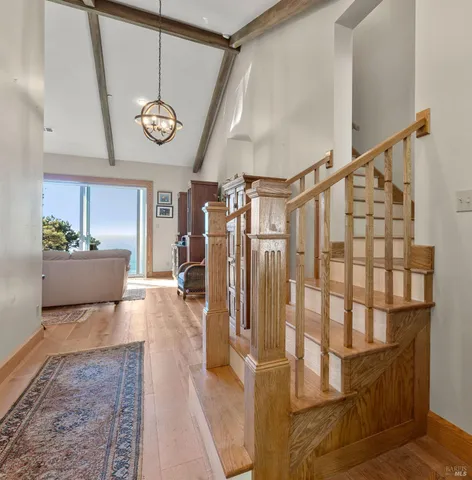 a view of entryway with a rug and a clock