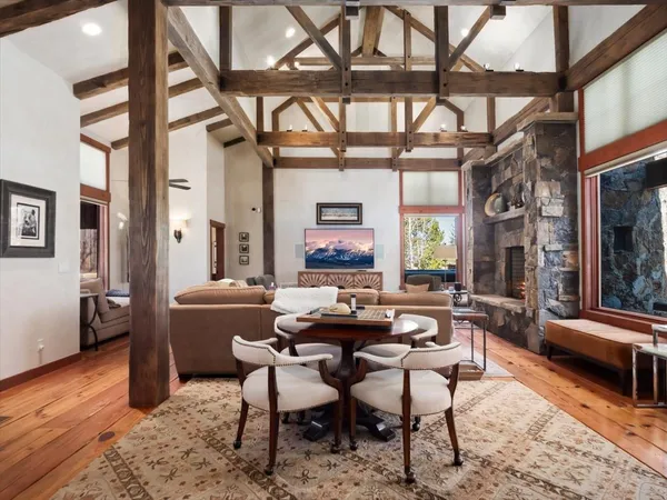 a view of a dining room with furniture window and wooden floor