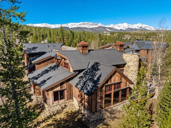an aerial view of a house with a mountain view