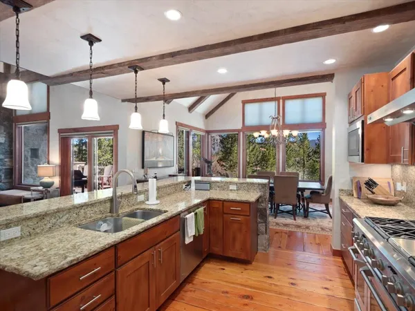 a large kitchen with lots of counter space and a sink