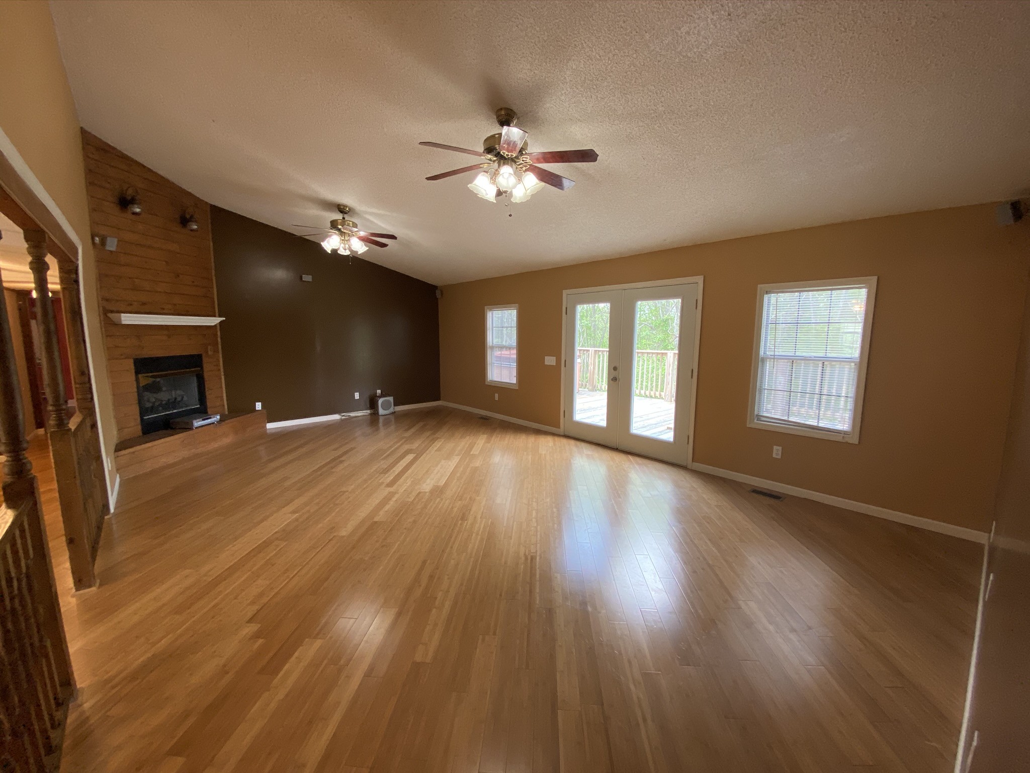 1340 Throneberry Road Normandy, TN 37360 - Photo 12 of 37 a view of a livingroom with wooden floor and a ceiling fan