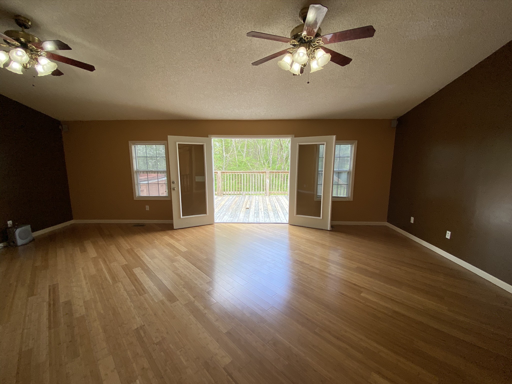 1340 Throneberry Road Normandy, TN 37360 - Photo 14 of 37 a view of empty room with wooden floor and fan