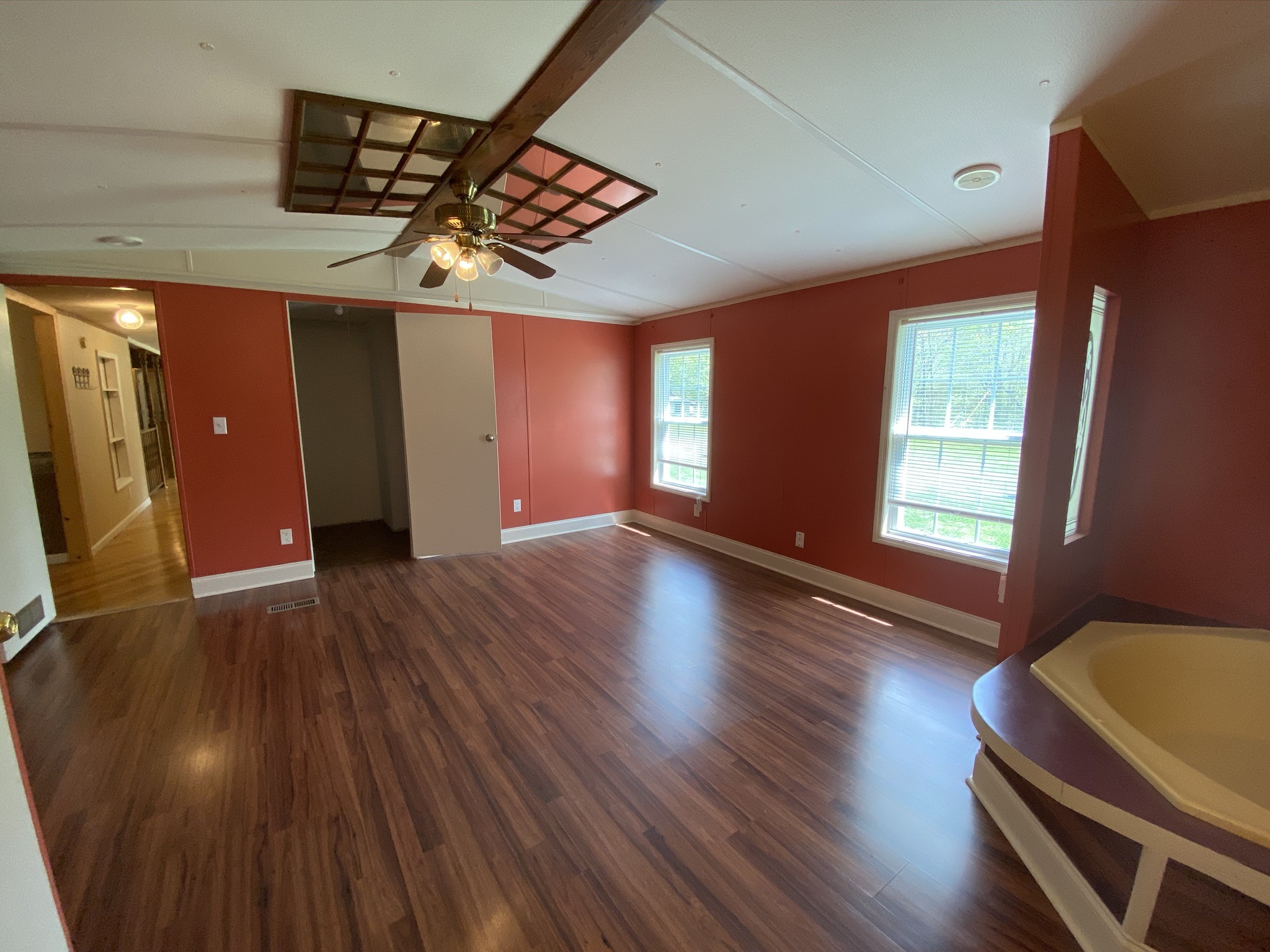 1340 Throneberry Road Normandy, TN 37360 - Photo 17 of 37 a view of an empty room with wooden floor and a window
