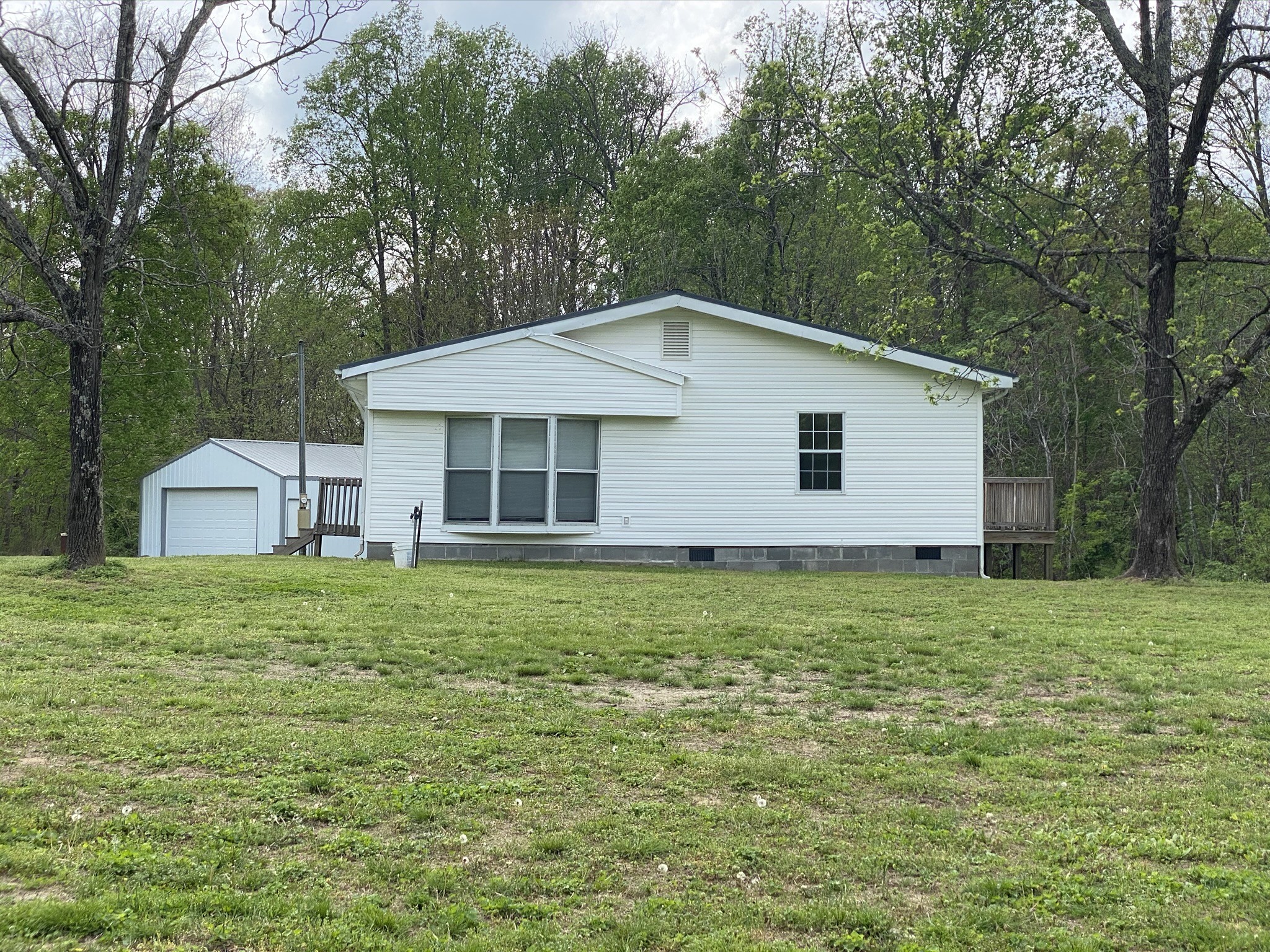 1340 Throneberry Road Normandy, TN 37360 - Photo 2 of 37 a front view of a house with a garden