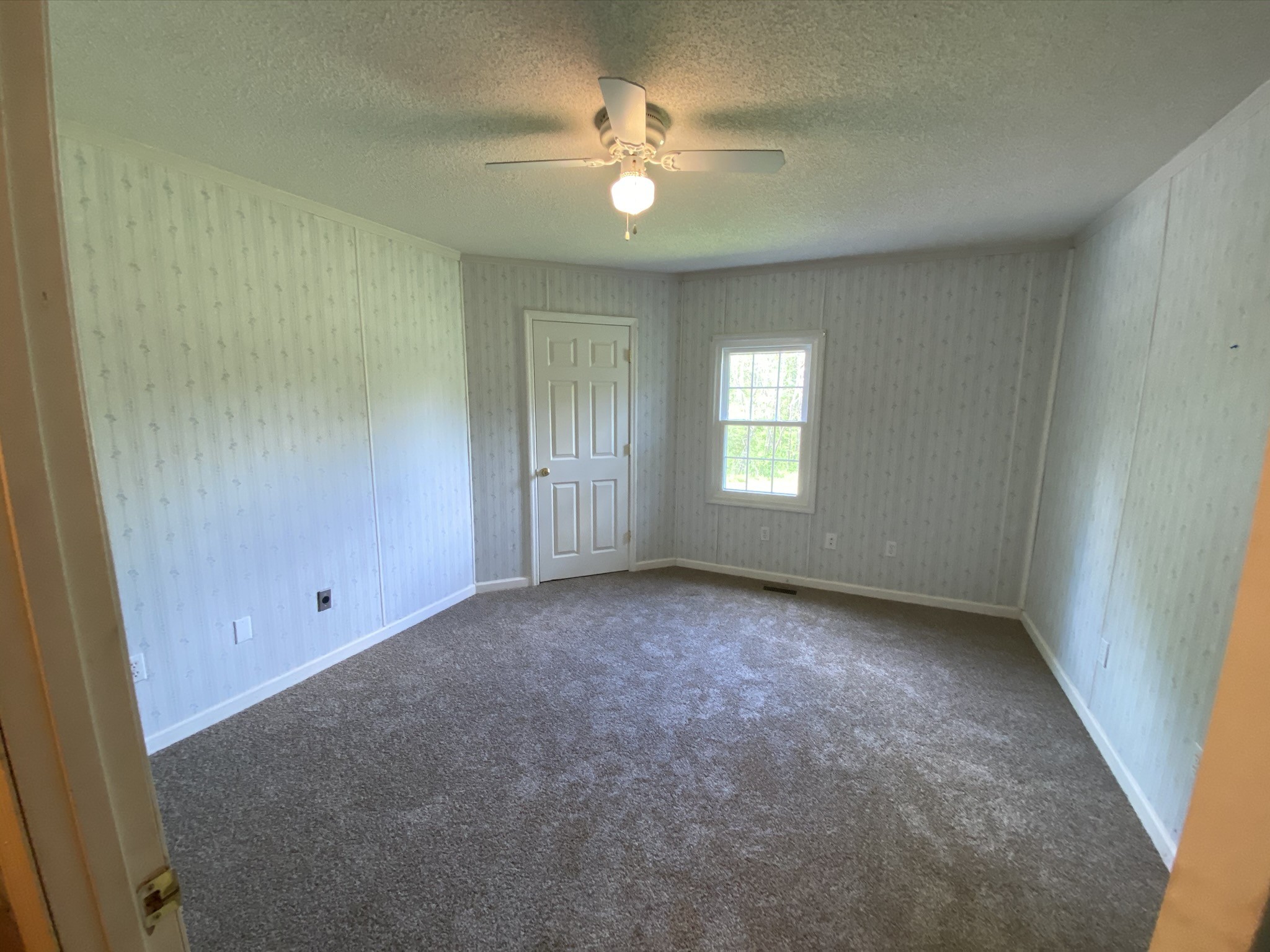 1340 Throneberry Road Normandy, TN 37360 - Photo 33 of 37 an empty room with windows and fan