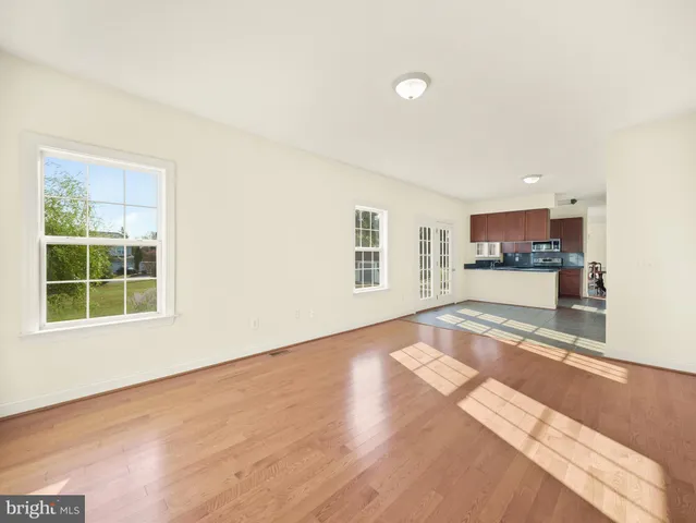 a bedroom with a bed and a ceiling fan