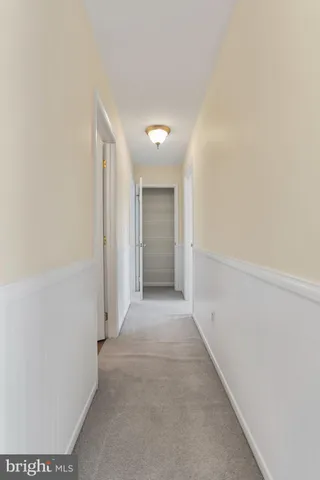 an aerial view of a houses with a swimming pool