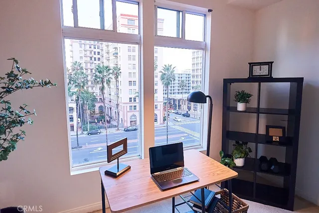 a kitchen with granite countertop a sink stove and cabinets