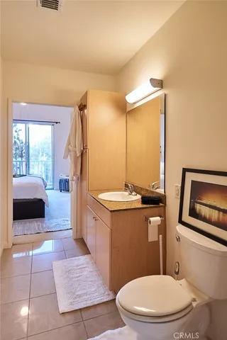 a city street lined with buildings and trees