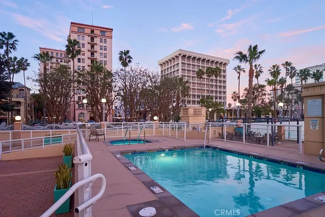 a city street lined with buildings and trees