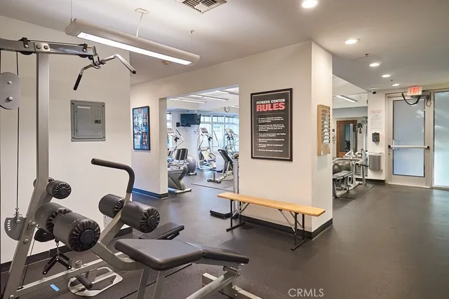 a living room with furniture a air conditioner vent and a window