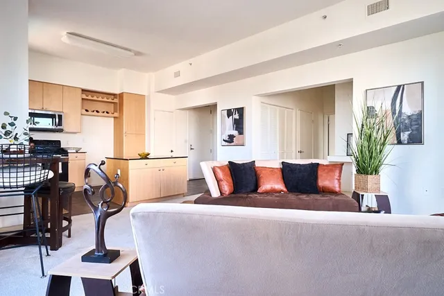 a living room with furniture and a rug