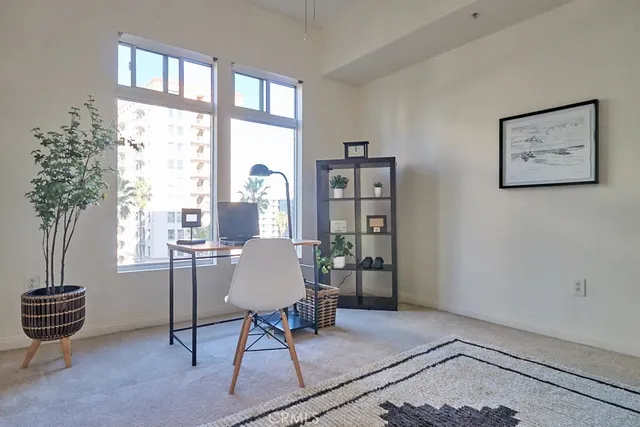 a view of a hallway with bathroom and a yard