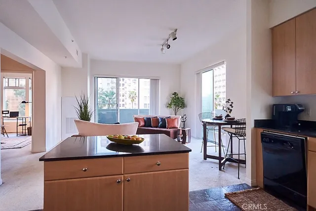 a kitchen with a table chairs stove and cabinets