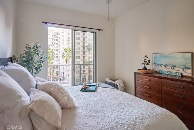 a bed room with a bed and a window