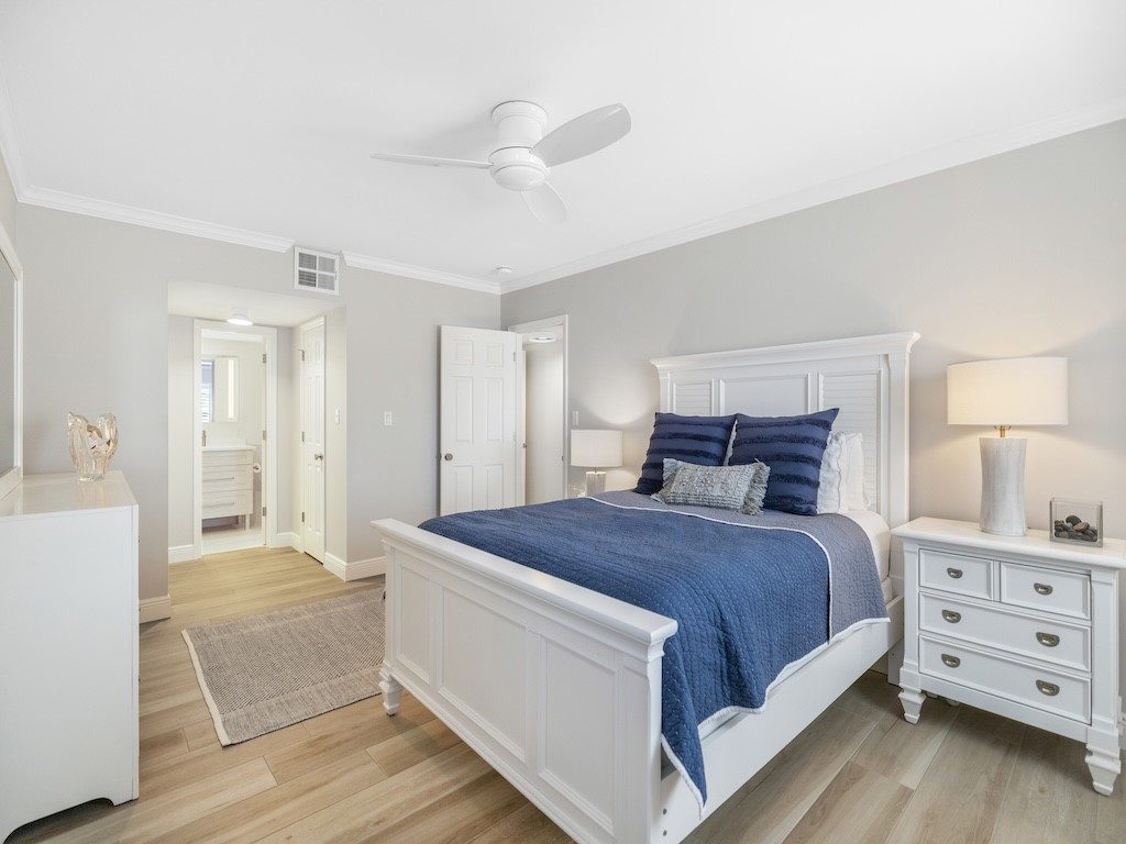 1180 Reef Road, Unit A24 Vero Beach, FL 32963 - Photo 12 of 26 a bedroom with a bed and a dresser