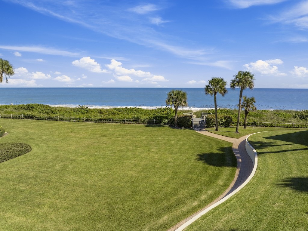 1180 Reef Road, Unit A24 Vero Beach, FL 32963 - Photo 21 of 26 a view of a lake with houses in the back