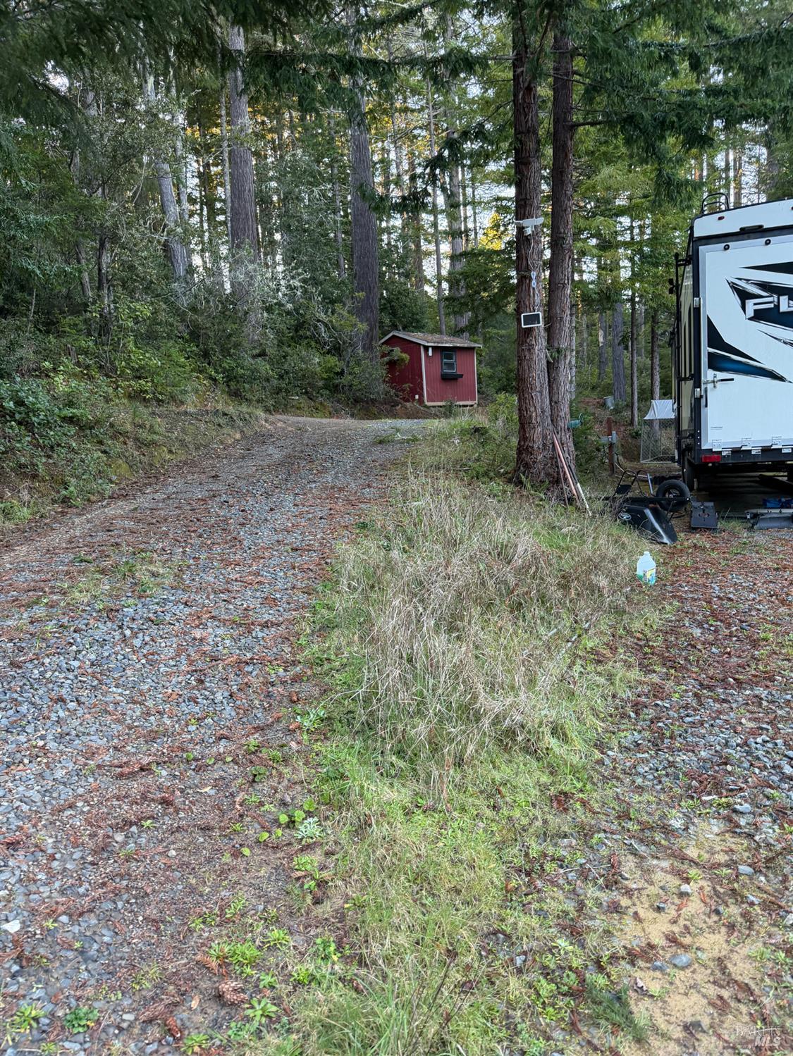 40741 Garcia River Road Point Arena, CA 95468 - Photo 3 of 7 a backyard of a house with wooden floor and fence