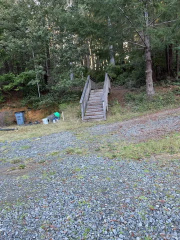 a backyard of a house with lots of green space