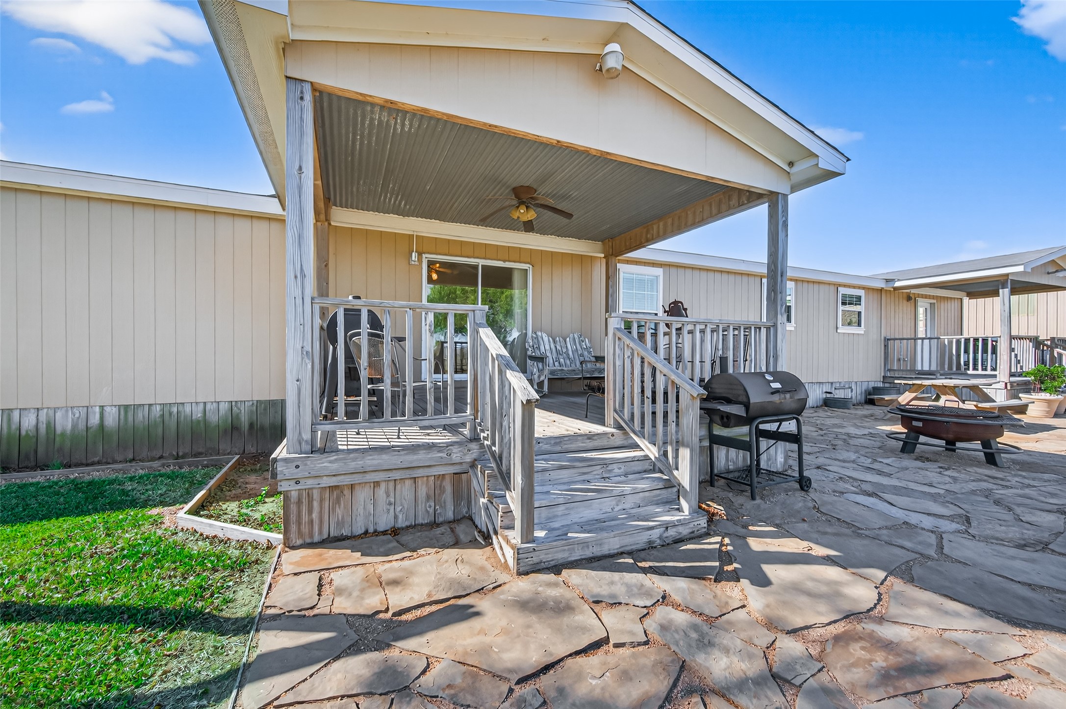 32445 Knebel Road Waller, TX 77484 - Photo 21 of 49 a view of a patio with table and chairs with wooden floor and fence